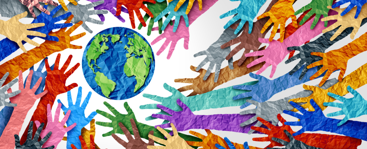 multicolor hands reaching towards a globe