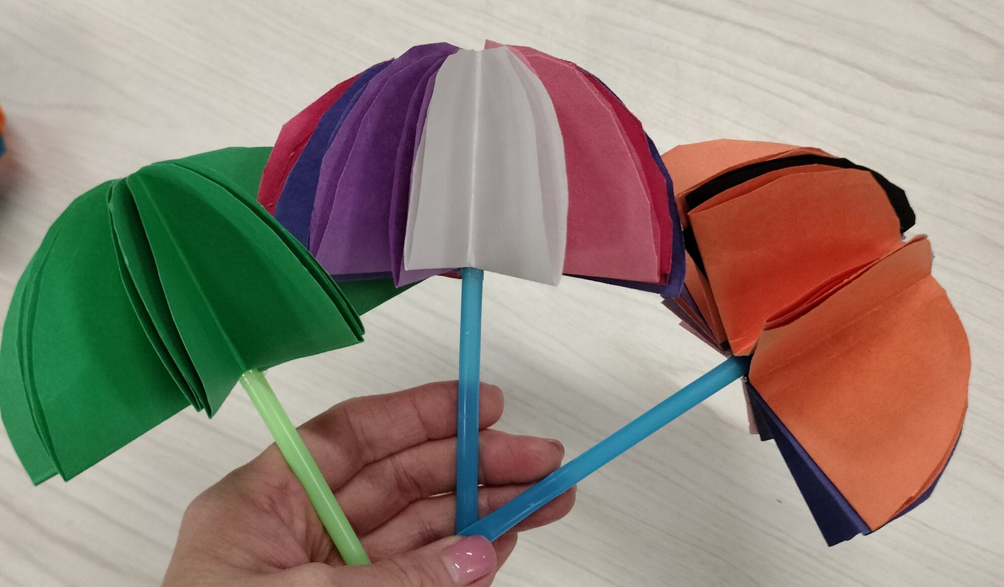 Tiny umbrellas made in a craft program.